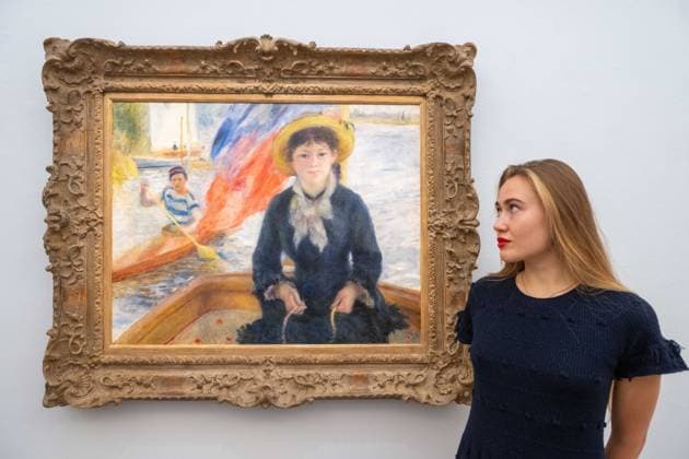 September 30, 2026, London, England, United Kingdom: Pierre-Auguste Renoir En Canot (Jeune fille a la barque), estimated at around USD 25-30 million, is seen with a staff member during a media preview of the Blaquier-Arrieta Collection at Sotheby s in London, Britain, September 30, 2026. The collection of 12 largely unseen Impressionist and Modern works will be offered at auction in New York in November. London United Kingdom - ZUMAk172 20260930_zip_k172_014 Copyright: xThomasxKrychx
