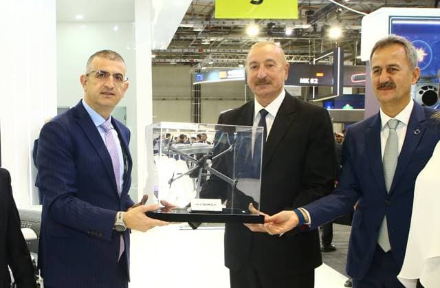 Azerbaijani President Ilham Aliyev visits ASELSAN and Baykar stands at ADEX 2026 BAKU, AZERBAIJAN - SEPTEMBER 30: Azerbaijani President Ilham Aliyev (C) attends the opening of the 6th International Defense Exhibition (ADEX 2026) at Baku Expo Center in Baku, Azerbaijan, on September 30, 2026. Aliyev visits the ASELSAN and Baykar stands, where Turkish Presidency of Defense Industry President Haluk Gorgun (R), ASELSAN General Manager Ahmet Akyol and Baykar General Manager Haluk Bayraktar (L) provide information about the companies products and technologies. Resul Rehimov Anadolu Baku Azerbaijan. Editorial use only. Please get in touch for any other usage.  Copyright: x2026xAnadoluxResulxRehimovx
