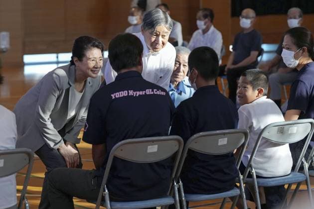 Emperor, empress visit quake-hit Kumamoto Pref. Japan s Emperor Naruhito and Empress Masako talk on Sept. 30, 2026, with people in Hikawa, a Kumamoto Prefecture town devastated by a massive earthquake in late July. (Pool photo)  A14AA0005629471P