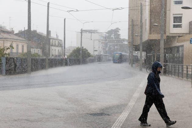 Pedestrian in heavy rain Benjamin ELKAIM MAXPPP Montpellier September 30, 2026 A person wearing a hooded coat crosses the street in heavy rain in Montpellier during the Mediterranean weather event of September 30, 2026. The roadway and tram tracks are covered with water. Montpellier, France, Sept. 30, 2026: the first heavy rains after summer in southern France. Montpellier, FRANCE  Copyright: xMAXPPPxBenjaminxELKAIMx ELK202609305204 ELK202609305204