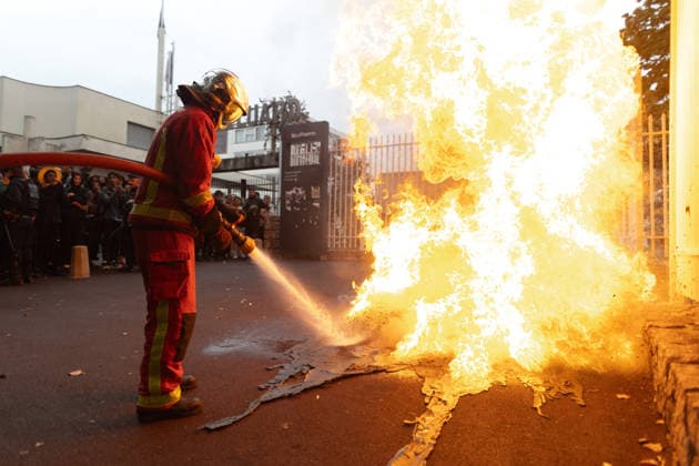 Students protest in front of Paul Eluard Secondary school - Saint-Denis RL Firefighters extinguish burning trashes. Students pictured in front of Paul Eluard secondary school in Saint-Denis, North of Paris, on September 30, 2026 as they continue their protest to demand the hiring of substitute teachers, increased resources, and decent learning conditions. Photo by Raphael Lafargue ABACAPRESS.COM Saint-Denis France  Copyright: xLafarguexRaphael ABACAx