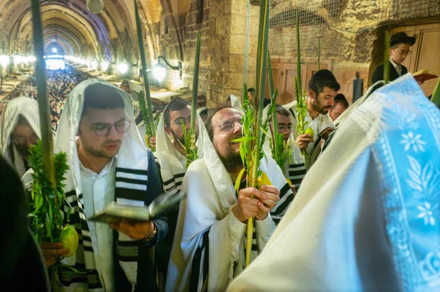 Religious Jews hold the four species as they perform morning prayers during the Holy Week of Sukkot, or the Feast of Tabernacles, in the Moslem Quarter in Jerusalem on Wednesday, September 30. 2026 Thousands of Jews, mostly ultra-Orthodox, packed a street leading to a gate, which was closed, leading into the Temple Mount or the á¸¤aram al Sharif where the Al Aqsa Mosque is located.  JER20260930012 JimxHollander