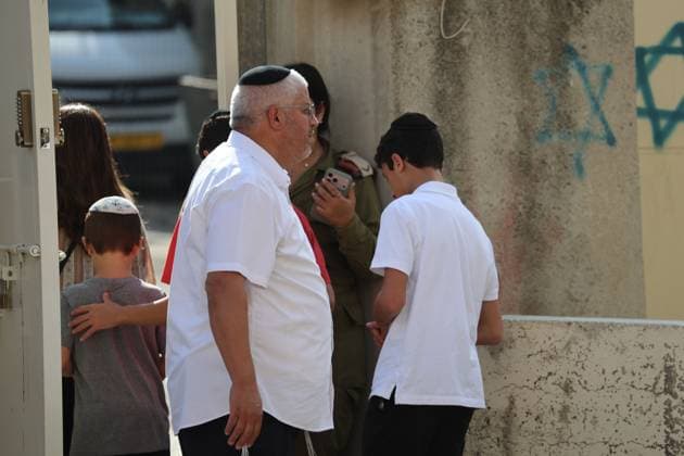 September 30, 2026, Hebron, Palestine, State of: HEBRON, OCCUPIED WEST BANK, SEPTEMBER 30, 2026: Israeli settlers walk through Hebron s Old City under the protection of Israeli forces during celebrations for the Jewish holiday of Sukkot. Israeli forces maintained heightened security measures and movement restrictions around the Old City and the Ibrahimi Mosque during the holiday period. Hebron Palestine, State of  - ZUMAq101 20260930_zna_q101_117 Copyright: xMosabxShawerx