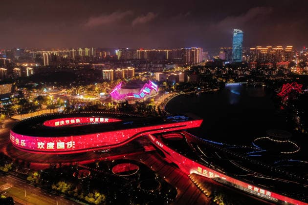 SUZHOU, CHINA - SEPTEMBER 30: A National Day themed light show illuminates the night sky at Shishan Cultural Plaza on September 30, 2026 in Suzhou, Jiangsu Province of China. The event features red lighting displays to celebrate the upcoming National Day holiday.  Copyright: xVCGx 111670785170