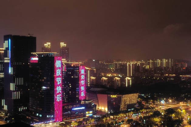 SUZHOU, CHINA - SEPTEMBER 30: A light show illuminates Shishan Cultural Plaza on September 30, 2026 in Suzhou, Jiangsu Province of China. The display features National Day themed lights to celebrate the upcoming holiday.  Copyright: xVCGx 111670786820