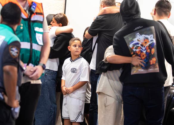 Israeli passengers hug relatives as they exit Ben Gurion International Airport after experiencing an attempted attack aboard a Fly Dubai flight in Lod, Israel on Wednesday, September 30, 2026. The Fly Dubai jet liner was transporting 180 passengers when a co-pilot, who was subdued by passengers, attempted to crash the plane as it approached Tel Aviv.  ISR20260608104 JimxHollander