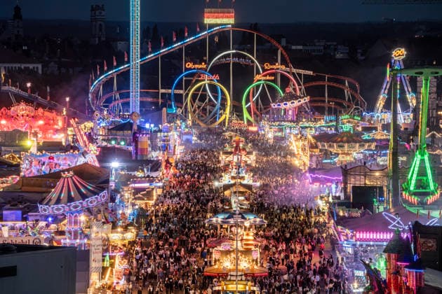 A view from St. Paul’s Church, 50 meters above ground, of the sea of lights at the Wiesn in the evening; the Oktoberfest glows in eve