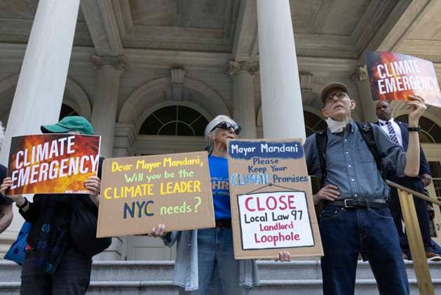 September 30, 2026, New York, New York, USA: Environmental advocates rally on the City Hall steps calling for Mayor Mamdani to keep his campaign promises to decarbonize New York City. Participants hold signs that read CLIMATE EMERGENCY Mayor Mamdani Please Keep Your CLIMATE Promises CLOSE Local Law 97 Landlord Loophole Dear Mayor Mamdani Will you be the CLIMATE LEADER NYC needs? Organizers call for the mayor to close the loophole in NYCâ€⠢s primary climate law, Local Law 97, to invest in green healthy public schools, fight fossil fuel infrastructure and fracked gas power plants. Participating organizations are Food & Water Watch, ALIGN, TREEage, NYPIRG, Rise & Resist, New York Communities for Change, Sunrise Movement NYC, Climate - ZUMAr174 20260930_znp_r174_005 Copyright: xGinaxMxRandazzox