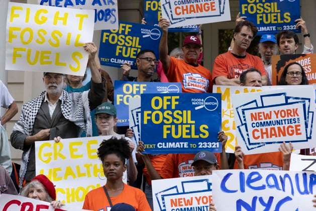 September 30, 2026, New York, New York, USA: Environmental advocates rally on the City Hall steps calling for Mayor Mamdani to keep his campaign promises to decarbonize New York City. Participants hold signs that read FIGHT FOSSIL FUELS OFF FOSSIL FUELS. Organizers call for the mayor to close the loophole in NYCâ€⠢s primary climate law, Local Law 97, to invest in green healthy public schools, fight fossil fuel infrastructure and fracked gas power plants. Participating organizations are Food & Water Watch, ALIGN, TREEage, NYPIRG, Rise & Resist, New York Communities for Change, Sunrise Movement NYC, Climate Defenders, Climate Defiance and Hot Girls Organize. New York USA - ZUMAr174 20260930_znp_r174_013 Copyright: xGinaxMxRandazzox