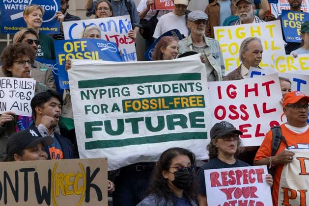 September 30, 2026, New York, New York, USA: Environmental advocates rally on the City Hall steps calling for Mayor Mamdani to keep his campaign promises to decarbonize New York City. Participants hold a banner that reads NYPIRG STUDENTS FOR A FOSSIL-FREE FUTURE. Organizers call for the mayor to close the loophole in NYCâ€⠢s primary climate law, Local Law 97, to invest in green healthy public schools, fight fossil fuel infrastructure and fracked gas power plants. Participating organizations are Food & Water Watch, ALIGN, TREEage, NYPIRG, Rise & Resist, New York Communities for Change, Sunrise Movement NYC, Climate Defenders, Climate Defiance and Hot Girls Organize. New York USA - ZUMAr174 20260930_znp_r174_022 Copyright: xGinaxMxRandazzox