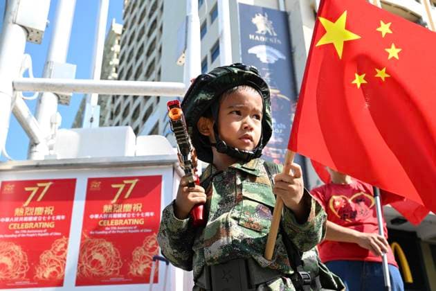 RECORD DATE NOT STATED China s National Day In Hong Kong A child wearing Chinese military uniform, holding a national flag of China and a toy gun on October 1, 2026 in Hong Kong. Today is the China s National Day. (Photo by STR Nexpher Images) Hong Kong