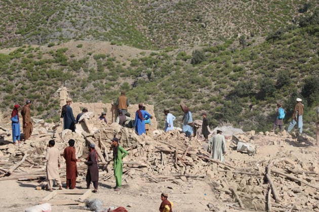 (261001) -- KUNAR, Oct. 1, 2026 -- This photo taken on Oct. 1, 2026 shows people clearing debris at a village after an airstrike in Kunar province, Afghanistan. Afghan government spokesperson Zabihullah Mujahid said on Thursday that Pakistani airstrikes hit the eastern Afghan province of Kunar early in the day, killing nine people and injuring 11 others, while three houses were also damaged. (Photo by Xinhua) AFGHANISTAN-KUNAR-PAKISTANI AIRSTRIKES QazafixMal 