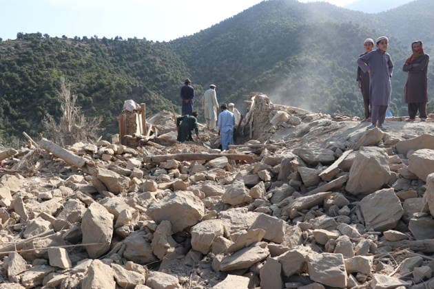 (261001) -- KUNAR, Oct. 1, 2026 -- This photo taken on Oct. 1, 2026 shows people clearing debris at a village after an airstrike in Kunar province, Afghanistan. Afghan government spokesperson Zabihullah Mujahid said on Thursday that Pakistani airstrikes hit the eastern Afghan province of Kunar early in the day, killing nine people and injuring 11 others, while three houses were also damaged. (Photo by Xinhua) AFGHANISTAN-KUNAR-PAKISTANI AIRSTRIKES QazafixMal 