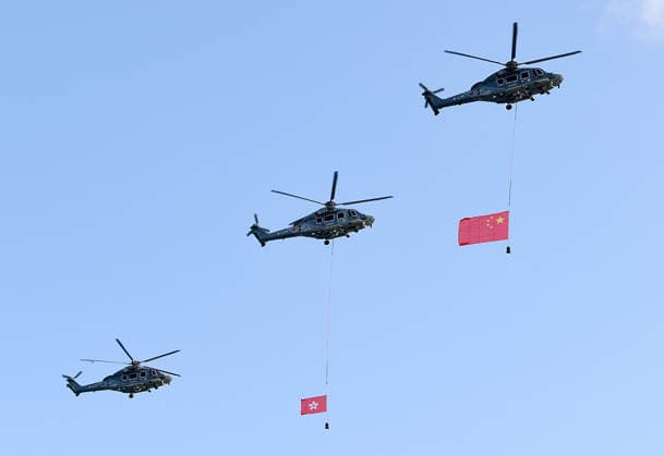 (261001) -- HONG KONG, Oct. 1, 2026 -- Helicopters carrying China s national flag and the flag of the Hong Kong Special Administrative Region (HKSAR) are seen in south China s Hong Kong, Oct. 1, 2026. The HKSAR government on Thursday held a flag-raising ceremony and a reception to celebrate the 77th anniversary of the founding of the People s Republic of China. ) CHINA-HONG KONG-NATIONAL DAY-CELEBRATION (CN) ChenxDuo 