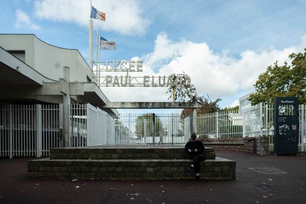 Burn marks at LycÃ e Paul Eluard A student sits and reads in front of the entrance to LycÃ e Paul Eluard in Saint-Denis during a student mobilization in France. Paris - St. Denis France  Copyright: xNikxErikxNeubauerx DSC_8294
