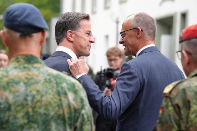Visit by the German-Dutch Corps with Federal Chancellor Merz; Federal Chancellor Friedrich Merz stands shoulder to shoulder with NATO Secretary General Mark Ruette during the military honors presented by the 1st German-Dutch Corps, Münster, October 1, 2026, Münster, North Rhine-Westphalia, Germany