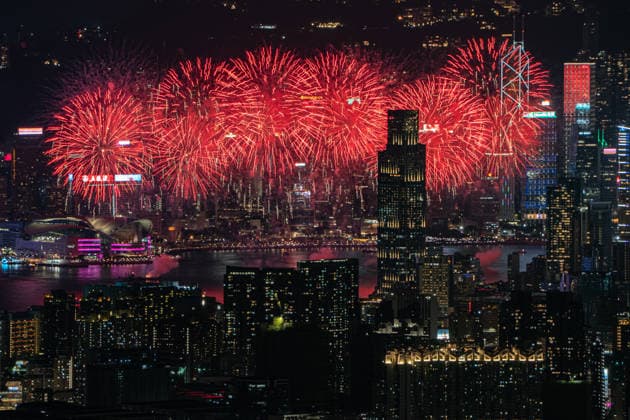 HONG KONG-DAILY NATIONAL-DAY A panoramic general view captured from Kowloon Peak (Fei Ngo Shan) shows fireworks illuminating the night sky above Victoria Harbour during the 77th National Day celebration on October 1, 2026 in Hong Kong, overlooking the expansive cityscapes of the southern Kowloon Peninsula and the illuminated skyline of northern Hong Kong Island. (Photo by Kevin Li TMHK via Nexpher Images) Hong Kong