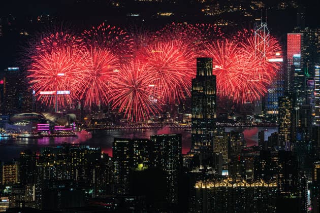 HONG KONG-DAILY NATIONAL-DAY A panoramic general view captured from Kowloon Peak (Fei Ngo Shan) shows fireworks illuminating the night sky above Victoria Harbour during the 77th National Day celebration on October 1, 2026 in Hong Kong, overlooking the expansive cityscapes of the southern Kowloon Peninsula and the illuminated skyline of northern Hong Kong Island. (Photo by Kevin Li TMHK via Nexpher Images) Hong Kong