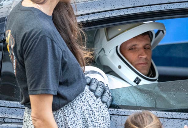 Canadian Astronaut Joshua Kutryk sits inside a walkout vehicle as he taps the belly of his pregnant wife Heather as he and the other NASA Crew-13 team ready to board a Dragon Spacecraft atop a SpaceX Falcon 9 rocket on SLC-40 at Kennedy Space Center, Florida on Thursday, October 1, 2026. They are on their way to the International Space Station.  KSC2026100107 PATxBENIC