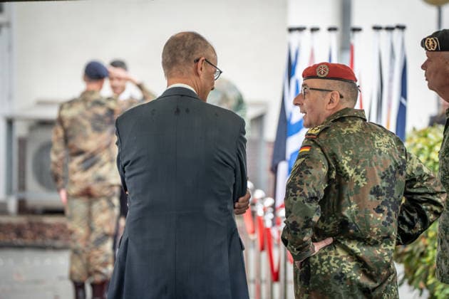 Chancellor Friedrich Merz (left) and Carsten Breuer, Inspector General of the Bundeswehr (wearing a red beret), meet with the Chancellor, the Prime Minister of the Netherlands, and the NATO Secretary General at the 1st German-Dutch Corps in Münster, Münster, North Rhine-Westphalia, Germany; German-Dutch Corps