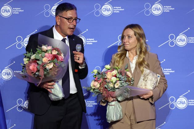 IPA89184710 - Rome, Italy October 1, 2026 CNA President Dario Costantini presents an award and a bouquet of flowers to Giorgia Meloni. Celebrations marking the 80th anniversary of the CNA are taking place at the Antonianum Auditorium. Prime Minister Giorgia Meloni is scheduled to attend the event at 5:00 p.m. for a gathering dedicated to the world of Italian crafts and small and medium-sized enterprises.  Copyright: xmarcoxiacobuccix xmarcoxiacobuccix IPA89184710