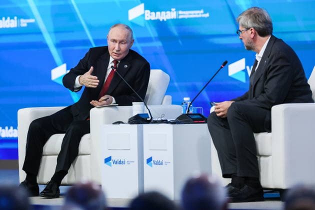 RUSSIA, MOSCOW REGION - OCTOBER 1, 2026: Russia s President Vladimir Putin (L) and Research Director of the Foundation for Development and Support of the Valdai Discussion Club, Editor-in-Chief of the Russia in Global Affairs Journal, Fyodor Lukyanov are seen during a plenary session titled Responsibility for the Future: Limits of the Possible or Possibilities Without Limit? at the 23th annual meeting of the Valdai Discussion Club in Istra. Alexander Shcherbak TASS  98627440