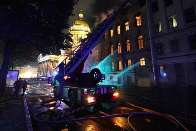 RUSSIA, ST PETERSBURG - OCTOBER 1, 2026: Fire crews battle a fire at the Miller Manions in St Isaac s Square. Valentin Yegorshin TASS  98634061