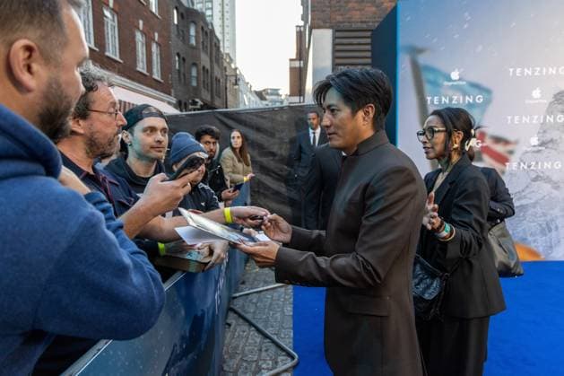 October 1, 2026, London, United Kingdom: Genden Phuntsok signs autographs with fans at the Gala Screening of TENZING at Curzon Mayfair, London.Cast and Guests attend the red carpet for the London Gala Screening of TENZING at Curzon Mayfair London United Kingdom  - ZUMAs197 20261001_aaa_s197_290 Copyright: xPhilxLewisx