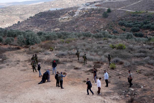 Israeli settlers intervene against Palestinians olive-picking event in Nablus town NABLUS, WEST BANK, PALESTINE - OCTOBER 02: Israeli settlers, under the protection of Israeli forces, intervene against an olive-picking event organized by Palestinians and a group of activists in the town of Beita, in Nablus, West Bank, Palestine on October 02, 2026. Issam Rimawi Anadolu Nablus West Bank. Editorial use only. Please get in touch for any other usage.  Copyright: x2026xAnadoluxIssamxRimawix