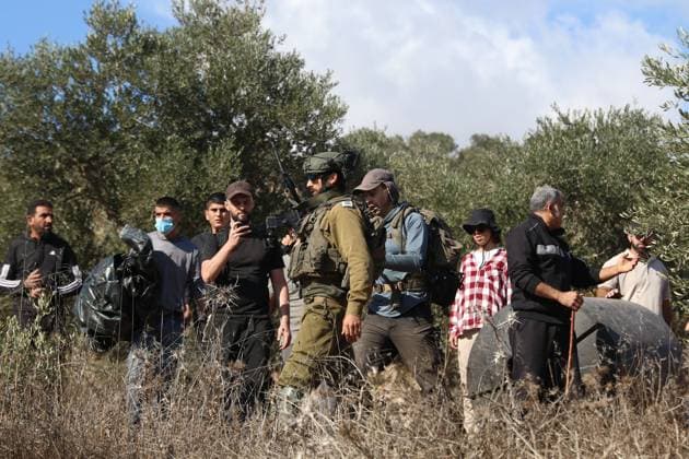 Israeli Settlers And Forces Attacked Palestinian Farmers During Olive Harvest In Beita BEITA, NABLUS, PALESTINE OCTOBER 2, 2026: Israeli settlers and Israeli forces attacked Palestinian farmers while they were picking olives in the Jabal Al-Arma area, east of Beita, south of Nablus. Settlers fired live ammunition toward the farmers, with no injuries reported. According to the Palestinian Red Crescent Society, Israeli forces also beat a 46-year-old Palestinian farmer during raids on olive farms in Beita. Witnesses told Anadolu that Israeli forces fired stun grenades and tear gas at farmers in the Jabal Al-Arma area, forcing them to leave. The olive harvest begins in early October and continues through the end of November, making it an im Copyright: x xSalmanxMohsenxAlkhatibx xJNAxPressx