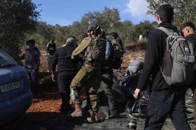 Israeli Settlers And Forces Attacked Palestinian Farmers During Olive Harvest In Beita BEITA, NABLUS, PALESTINE OCTOBER 2, 2026: Israeli settlers and Israeli forces attacked Palestinian farmers while they were picking olives in the Jabal Al-Arma area, east of Beita, south of Nablus. Settlers fired live ammunition toward the farmers, with no injuries reported. According to the Palestinian Red Crescent Society, Israeli forces also beat a 46-year-old Palestinian farmer during raids on olive farms in Beita. Witnesses told Anadolu that Israeli forces fired stun grenades and tear gas at farmers in the Jabal Al-Arma area, forcing them to leave. The olive harvest begins in early October and continues through the end of November, making it an im Copyright: x xSalmanxMohsenxAlkhatibx xJNAxPressx