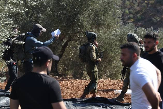 Israeli Settlers And Forces Attacked Palestinian Farmers During Olive Harvest In Beita BEITA, NABLUS, PALESTINE OCTOBER 2, 2026: Israeli settlers and Israeli forces attacked Palestinian farmers while they were picking olives in the Jabal Al-Arma area, east of Beita, south of Nablus. Settlers fired live ammunition toward the farmers, with no injuries reported. According to the Palestinian Red Crescent Society, Israeli forces also beat a 46-year-old Palestinian farmer during raids on olive farms in Beita. Witnesses told Anadolu that Israeli forces fired stun grenades and tear gas at farmers in the Jabal Al-Arma area, forcing them to leave. The olive harvest begins in early October and continues through the end of November, making it an im Copyright: x xSalmanxMohsenxAlkhatibx xJNAxPressx