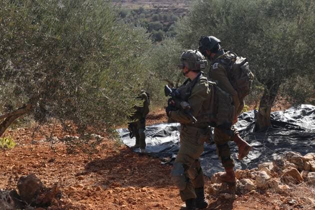 Israeli Settlers And Forces Attacked Palestinian Farmers During Olive Harvest In Beita BEITA, NABLUS, PALESTINE OCTOBER 2, 2026: Israeli settlers and Israeli forces attacked Palestinian farmers while they were picking olives in the Jabal Al-Arma area, east of Beita, south of Nablus. Settlers fired live ammunition toward the farmers, with no injuries reported. According to the Palestinian Red Crescent Society, Israeli forces also beat a 46-year-old Palestinian farmer during raids on olive farms in Beita. Witnesses told Anadolu that Israeli forces fired stun grenades and tear gas at farmers in the Jabal Al-Arma area, forcing them to leave. The olive harvest begins in early October and continues through the end of November, making it an im Copyright: x xSalmanxMohsenxAlkhatibx xJNAxPressx