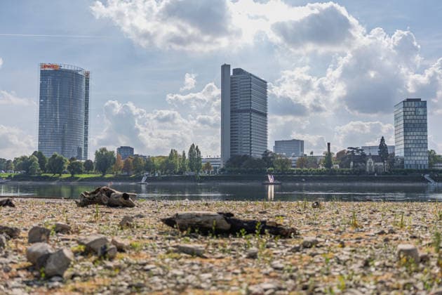 Low Water Levels on the Rhine in Bonn, October 2, 2026. Following the recent rains, the water level in Bonn is rising slightly again and stands at 64 cm, just slightly above the record low of 58 cm set on September 29. In the background is the Bonn skyline with the Post Tower, Langer Eugen, Climate Tower, UN Campus, Bonn-Beuel, North Rhine-Westphalia, Germany Copyright: xMarcxJohnx