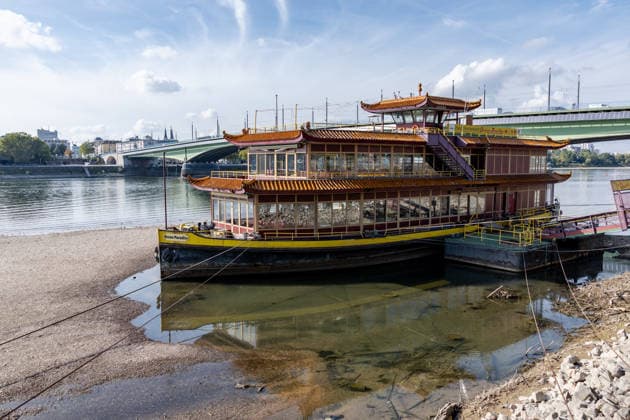 Low Water Levels on the Rhine in Bonn: The China Ship at the Kennedy Bridge, October 2, 2026. View of the Kennedy Bridge in Bonn. Due to the ongoing low water levels, the so-called China Ship —the restaurant ship Ocean Paradise, which has been closed since 2023—is is almost high and dry. Na Copyright: xMarcxJohnx
