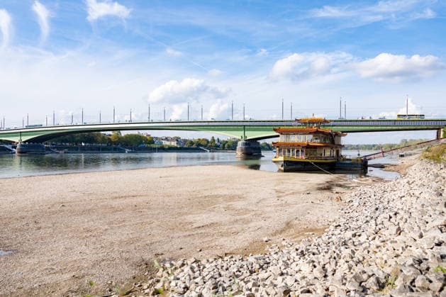 Low Water Levels on the Rhine in Bonn: The China Ship at the Kennedy Bridge, October 2, 2026. View of the Kennedy Bridge in Bonn. Due to the ongoing low water levels, the so-called China Ship —the restaurant ship Ocean Paradise, which has been closed since 2023—is is almost high and dry. Na Copyright: xMarcxJohnx