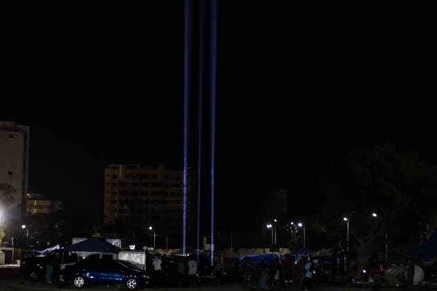October 2, 2026, La Guaira, Venezuela (Bolivarian Republic of: LA GUAIRA, VENEZUELA, OCTOBER 2, 2026: Families of victims, survivors and rescue workers gather during the Haz de Luz vigil in La Guaira to commemorate 100 days since the devastating earthquakes of June 24. Participants lit candles and joined prayers in memory of those killed and missing, while beams of light were projected into the sky near areas heavily damaged by the disaster. The commemorative event brought together residents, volunteers and emergency workers as recovery and search efforts continue in parts of La Guaira. La Guaira Venezuela (Bolivarian Republic of - ZUMAq101 20261002_zna_q101_307 Copyright: xMarioxFloresx