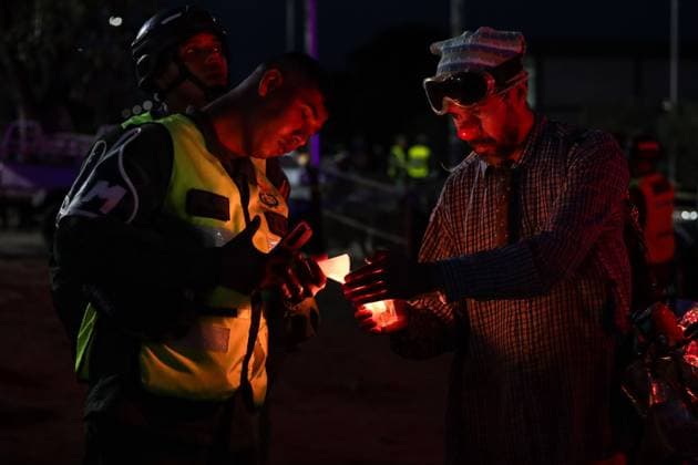 October 2, 2026, La Guaira, Venezuela (Bolivarian Republic of: LA GUAIRA, VENEZUELA, OCTOBER 2, 2026: Families of victims, survivors and rescue workers gather during the Haz de Luz vigil in La Guaira to commemorate 100 days since the devastating earthquakes of June 24. Participants lit candles and joined prayers in memory of those killed and missing, while beams of light were projected into the sky near areas heavily damaged by the disaster. The commemorative event brought together residents, volunteers and emergency workers as recovery and search efforts continue in parts of La Guaira. La Guaira Venezuela (Bolivarian Republic of - ZUMAq101 20261002_zna_q101_308 Copyright: xMarioxFloresx