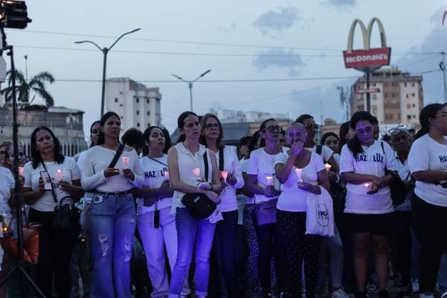 October 2, 2026, La Guaira, Venezuela (Bolivarian Republic of: LA GUAIRA, VENEZUELA, OCTOBER 2, 2026: Families of victims, survivors and rescue workers gather during the Haz de Luz vigil in La Guaira to commemorate 100 days since the devastating earthquakes of June 24. Participants lit candles and joined prayers in memory of those killed and missing, while beams of light were projected into the sky near areas heavily damaged by the disaster. The commemorative event brought together residents, volunteers and emergency workers as recovery and search efforts continue in parts of La Guaira. La Guaira Venezuela (Bolivarian Republic of - ZUMAq101 20261002_zna_q101_314 Copyright: xMarioxFloresx