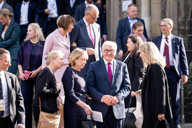 Celebrations for German Unity Day 2026 in Bremen: Federal President Frank Walter Steinmeier, along with his wife Elke Buedenbender, and Federal Chancellor Friedrich Merz (CDU) and his wife Charlotte Merz, seen behind them as they exit St. Petri Cathedral after the ecumenical service for German Unity Day 2026 in Bremen, Bremen, October 3, 2026, Bremen, Bremen,