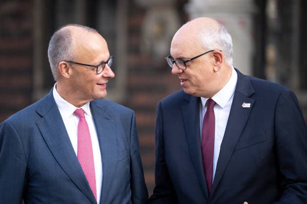 Celebrations for German Unity Day 2026 in Bremen: Federal Chancellor Friedrich Merz (CDU) in conversation with Andreas Bovenschulte, President of the Bundesrat, on the Marktplatz in Bremen during the celebrations for German Unity Day 2026, Bremen, October 3, 2026, Bremen, Bremen, Germany