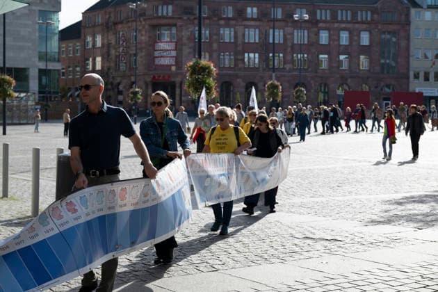 October 3, 2026 Press Event: Es brennt Initiative Human Chain in Dortmund, Hansaplatz Marching with the banner to Westenhellweg, Dortmund; Hansaplatz and Westenhellweg, North Rhine-Westphalia, Germany