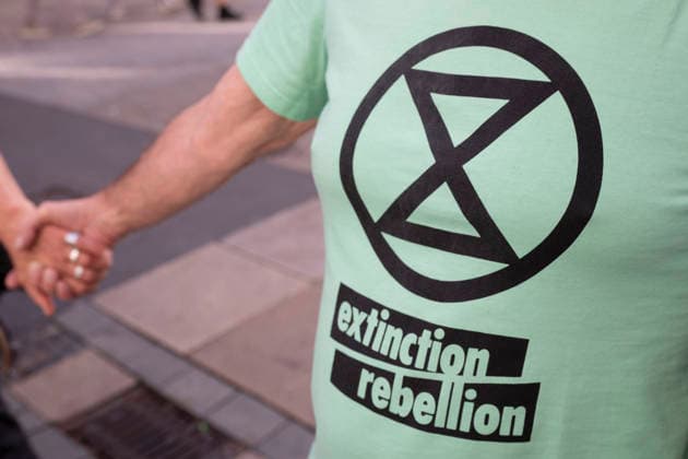 October 3, 2026 Press event: Es brennt initiative—human chain in Dortmund, Hansaplatz. Symbolic photo of Extinction Rebellion in Dortmund at Hansaplatz and Westenhellweg, North Rhine-Westphalia, Germany