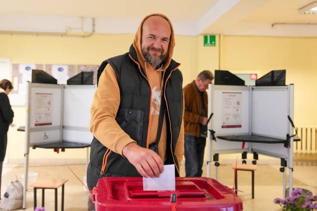 October 3, 2026, Riga, LATVIA: Man casts his vote at a polling station during the parliamentary elections in Riga, Latvia, Oct. 3, 2026. Riga LATVIA  - ZUMAp305 20261003_zip_p305_001 Copyright: xEdijsxPalensx