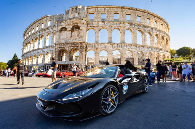 Ferrari Tour stops in Pula Luxury Ferrari sports cars taking part in a Ferrari Tour organized by Ineco Auto, are seen in front of the Roman Arena in Pula, Croatia, on October 3, 2026. While the drivers visit the ancient amphitheatre, local residents gather to watch and admire the vehicles.  SreckoxNiketic PIXSELL