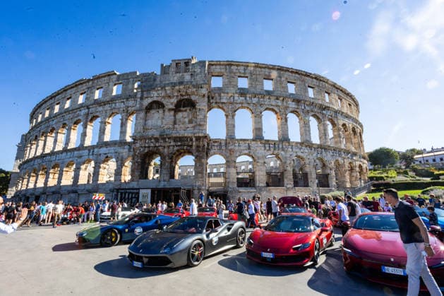 Ferrari Tour stops in Pula Luxury Ferrari sports cars taking part in a Ferrari Tour organized by Ineco Auto, are seen in front of the Roman Arena in Pula, Croatia, on October 3, 2026. While the drivers visit the ancient amphitheatre, local residents gather to watch and admire the vehicles.  SreckoxNiketic PIXSELL