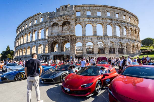 Ferrari Tour stops in Pula Luxury Ferrari sports cars taking part in a Ferrari Tour organized by Ineco Auto, are seen in front of the Roman Arena in Pula, Croatia, on October 3, 2026. While the drivers visit the ancient amphitheatre, local residents gather to watch and admire the vehicles.  SreckoxNiketic PIXSELL