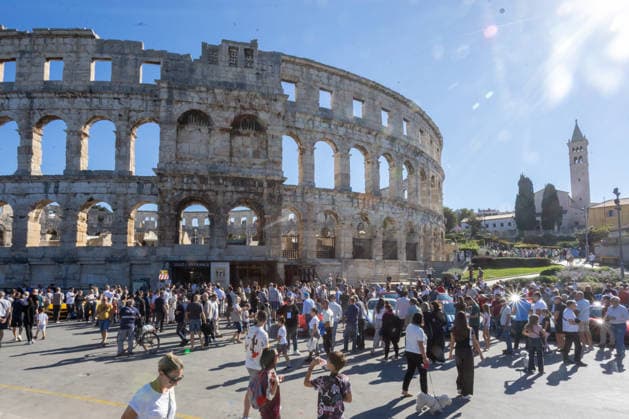 Ferrari Tour stops in Pula Luxury Ferrari sports cars taking part in a Ferrari Tour organized by Ineco Auto, are seen in front of the Roman Arena in Pula, Croatia, on October 3, 2026. While the drivers visit the ancient amphitheatre, local residents gather to watch and admire the vehicles.  SreckoxNiketic PIXSELL