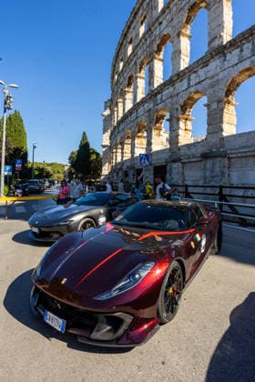 Ferrari Tour stops in Pula Luxury Ferrari sports cars taking part in a Ferrari Tour organized by Ineco Auto, are seen in front of the Roman Arena in Pula, Croatia, on October 3, 2026. While the drivers visit the ancient amphitheatre, local residents gather to watch and admire the vehicles.  SreckoxNiketic PIXSELL