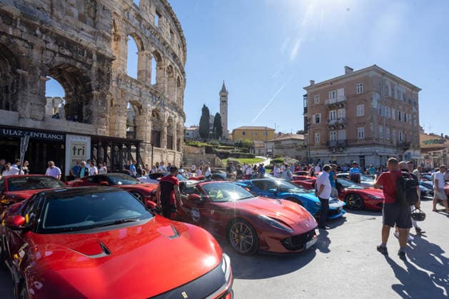 Ferrari Tour stops in Pula Luxury Ferrari sports cars taking part in a Ferrari Tour organized by Ineco Auto, are seen in front of the Roman Arena in Pula, Croatia, on October 3, 2026. While the drivers visit the ancient amphitheatre, local residents gather to watch and admire the vehicles.  SreckoxNiketic PIXSELL